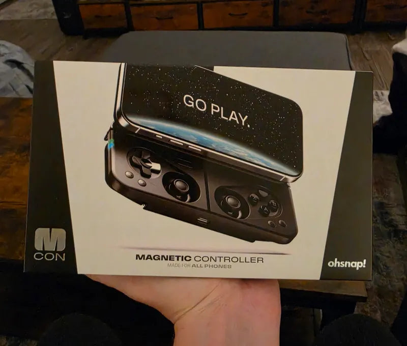 Customer holding the magnetic controller retail box
